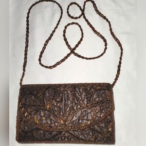 Bijoux Terner Bronze beads on brown satin bag